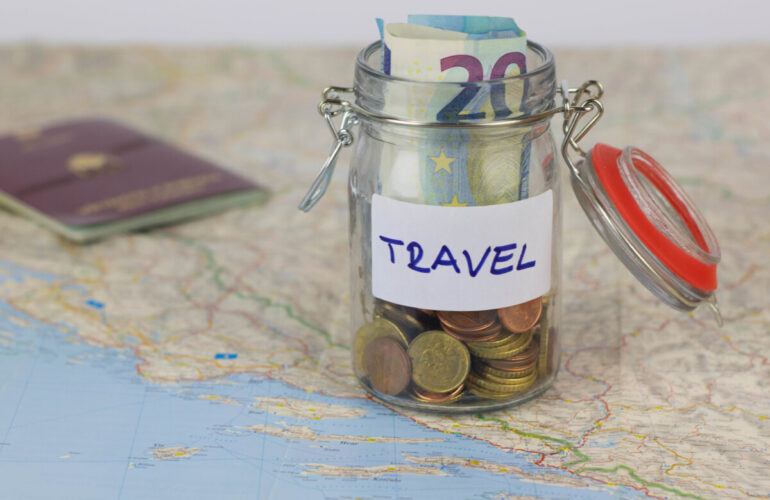 money in a jar allocated for travel purposes