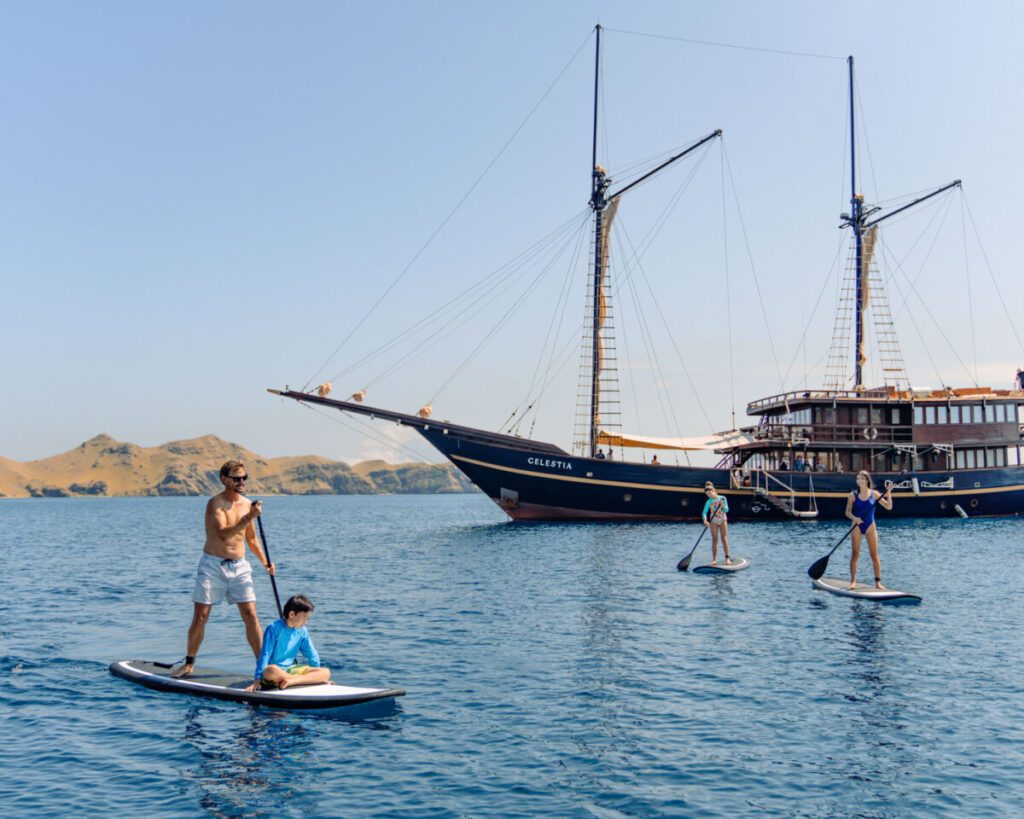 Paddle board on Komodo boat tour with Celestia yacht